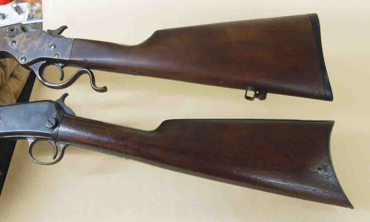 The stocks of the Stevens M414 (top) and Winchester M1890 (bottom) are almost black due to the failure of the original finish and 100 years of handling.